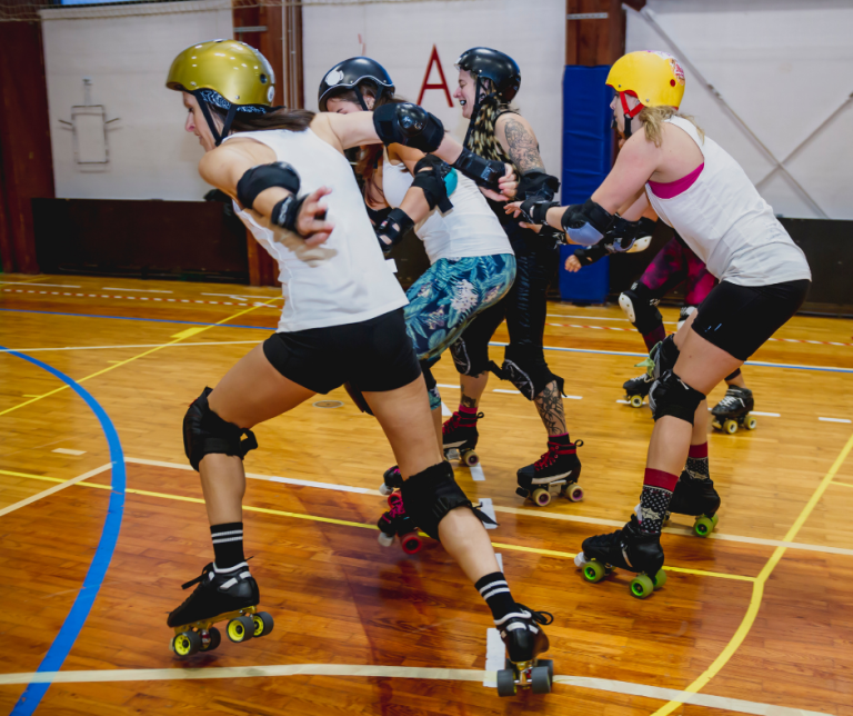 women playing roller derby